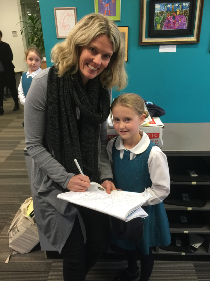 Jess Black with one of her reader fan sharing her writing.