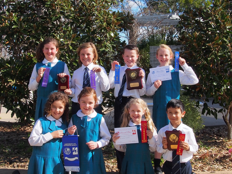 Some of the students in Years 1 to 4 showing off their achievements. 