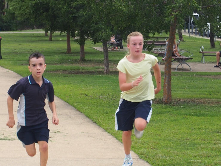 Isaac and Jasmyn running the track.