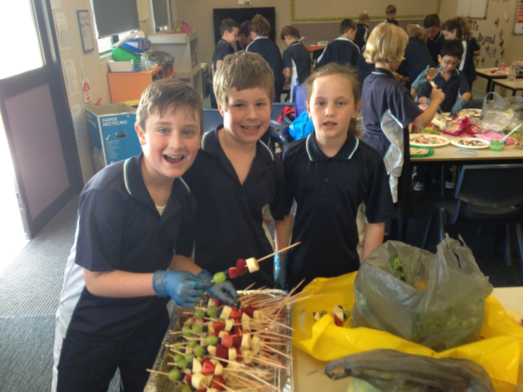 Some of the Year 3 students making fruit kebabs and other treats.
